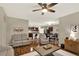 Spacious open-concept living room and dining area with wood floors and lots of natural light at 3828 Eloise Estates Ct, Winter Haven, FL 33881