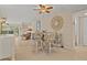 An open concept living area with comfortable seating and neutral decor at 400 El Camino Dr # 101, Winter Haven, FL 33884