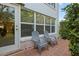 Private outdoor patio featuring seating and beautiful views with well maintained foliage at 400 El Camino Dr # 101, Winter Haven, FL 33884