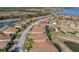 Beautiful aerial perspective of the home, displaying the property's proximity to the scenic pond and community surroundings at 4033 Phoenician Way, Winter Haven, FL 33884