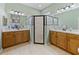 Bathroom featuring and sinks and glass enclosed shower at 4033 Phoenician Way, Winter Haven, FL 33884