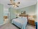 Spacious bedroom features a ceiling fan and ensuite bathroom access at 4033 Phoenician Way, Winter Haven, FL 33884