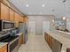 Spacious kitchen with stainless steel appliances and granite countertops at 4033 Phoenician Way, Winter Haven, FL 33884