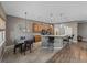 Cozy kitchen and dining area featuring a breakfast bar with stools and pendant lighting at 4033 Phoenician Way, Winter Haven, FL 33884