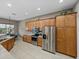 Well-lit kitchen featuring stainless steel appliances and breakfast nook at 4033 Phoenician Way, Winter Haven, FL 33884