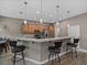 Kitchen featuring a breakfast bar with seating, stainless steel appliances, and granite countertops at 4033 Phoenician Way, Winter Haven, FL 33884