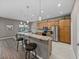 Open kitchen featuring a breakfast bar with pendant lighting and stainless steel appliances at 4033 Phoenician Way, Winter Haven, FL 33884