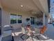 Enjoy the spacious covered lanai with seating, outdoor kitchen, and serene backyard views at 4033 Phoenician Way, Winter Haven, FL 33884