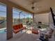Screened-in lanai featuring outdoor seating and a grill at 4033 Phoenician Way, Winter Haven, FL 33884