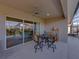 Enjoy the covered lanai with view of the pool, outdoor seating and a calming backyard view at 4033 Phoenician Way, Winter Haven, FL 33884