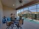Enjoy outdoor dining on this screened lanai, complete with a ceiling fan for maximum comfort at 4033 Phoenician Way, Winter Haven, FL 33884
