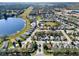 Aerial view of the neighborhood, showcasing the layout and proximity to a lake and lush scenery at 428 Lake Suzanne Dr, Lake Wales, FL 33859