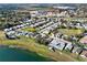 Aerial view of neighborhood featuring lake, open space and other residential homes at 428 Lake Suzanne Dr, Lake Wales, FL 33859