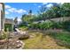 Well maintained backyard area featuring a patio with a seating area and lush landscaping at 428 Lake Suzanne Dr, Lake Wales, FL 33859