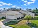 Charming home featuring a well-manicured lawn, two car garage and neutral color palette at 428 Lake Suzanne Dr, Lake Wales, FL 33859