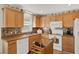 Bright kitchen featuring ample cabinet space, stainless island and countertops with modern appliances at 428 Lake Suzanne Dr, Lake Wales, FL 33859