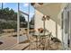 Enclosed lanai featuring a ceiling fan and plenty of seating at 428 Lake Suzanne Dr, Lake Wales, FL 33859