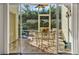Enclosed lanai featuring a ceiling fan and plenty of seating at 428 Lake Suzanne Dr, Lake Wales, FL 33859