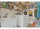 Laundry room with a utility sink, a washer, a dryer, and plenty of storage space at 428 Lake Suzanne Dr, Lake Wales, FL 33859