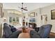 Inviting living room featuring large glass doors to screened porch and comfortable seating at 428 Lake Suzanne Dr, Lake Wales, FL 33859