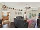 Open-concept living room with access to kitchen and sliding glass doors to screened porch at 428 Lake Suzanne Dr, Lake Wales, FL 33859