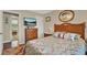 Comfortable main bedroom featuring wood furnishings and a mounted TV at 428 Lake Suzanne Dr, Lake Wales, FL 33859