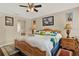 Large main bedroom with ceiling fan, bedside tables and ensuite bathroom at 428 Lake Suzanne Dr, Lake Wales, FL 33859