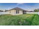 Large backyard with grassy area and privacy fence at 452 Palastro Ave, Auburndale, FL 33823