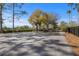 Outdoor basketball court with surrounding trees at 452 Palastro Ave, Auburndale, FL 33823
