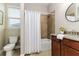 Clean bathroom with tub shower combo and granite countertop at 452 Palastro Ave, Auburndale, FL 33823