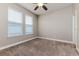 Bright bedroom with neutral walls and carpet flooring, ceiling fan at 452 Palastro Ave, Auburndale, FL 33823