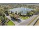 Gated community entrance with a scenic lake at 452 Palastro Ave, Auburndale, FL 33823