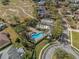 Community pool and recreation area with surrounding landscaping at 452 Palastro Ave, Auburndale, FL 33823