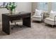 Modern home office boasts a large desk and two comfortable armchairs at 452 Palastro Ave, Auburndale, FL 33823