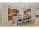 Modern kitchen with granite countertops, stainless steel appliances, and an island at 452 Palastro Ave, Auburndale, FL 33823