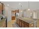 Modern kitchen with granite countertops, stainless steel appliances, and an island at 452 Palastro Ave, Auburndale, FL 33823