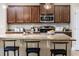 Kitchen island with granite countertop and seating for three at 452 Palastro Ave, Auburndale, FL 33823