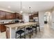 Modern kitchen with granite countertops, stainless steel appliances, and an island at 452 Palastro Ave, Auburndale, FL 33823