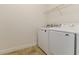 Bright laundry room with washer and dryer, and extra storage at 452 Palastro Ave, Auburndale, FL 33823