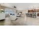Open floor plan living room and kitchen with tile floors at 452 Palastro Ave, Auburndale, FL 33823