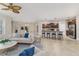 Open concept living room and kitchen with neutral decor at 452 Palastro Ave, Auburndale, FL 33823