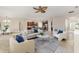 Open-concept living room with adjacent kitchen and dining area at 452 Palastro Ave, Auburndale, FL 33823