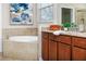 Elegant Primary bathroom with soaking tub and double vanity at 452 Palastro Ave, Auburndale, FL 33823