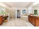 Large Primary bathroom with double vanity, shower, and soaking tub at 452 Palastro Ave, Auburndale, FL 33823