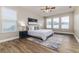 Spacious Primary bedroom with large windows and a ceiling fan at 452 Palastro Ave, Auburndale, FL 33823