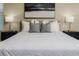 Luxurious Primary bedroom features a king bed and nightstands at 452 Palastro Ave, Auburndale, FL 33823