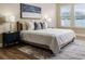 Bright Primary bedroom with a king-size bed and stylish decor at 452 Palastro Ave, Auburndale, FL 33823