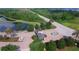 Aerial view of the landscaped entrance to the community, with fountain and well-maintained grounds at 4540 Turnberry Ln, Lake Wales, FL 33859