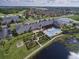 Beautiful aerial shot of a community center with a pool, garden chess and lush landscaping at 4540 Turnberry Ln, Lake Wales, FL 33859