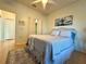 Bright bedroom with double door closets and bamboo floors showcases a queen bed at 4540 Turnberry Ln, Lake Wales, FL 33859